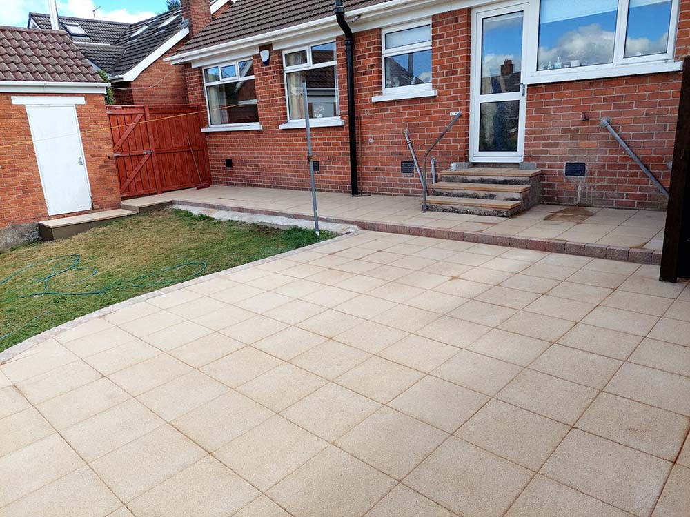 Garden makeover with newly laid sandstone paving slabs