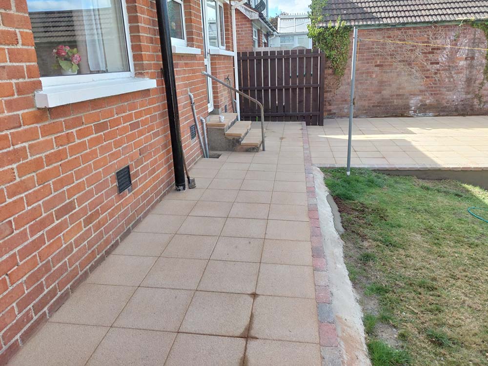 newly laid sandstone paving slabs with matching steps